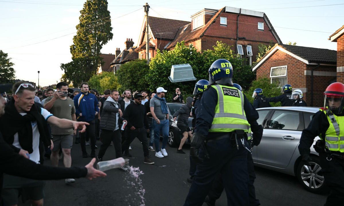 'I can't breathe': Protesters attack police at UK rally over student murder