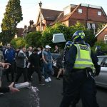 'I can't breathe': Protesters attack police at UK rally over student murder